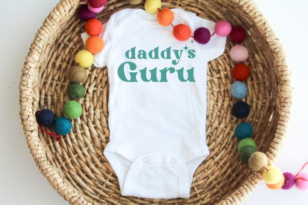 Non-toxic, water-based ink printing on baby tee — eco-friendly process