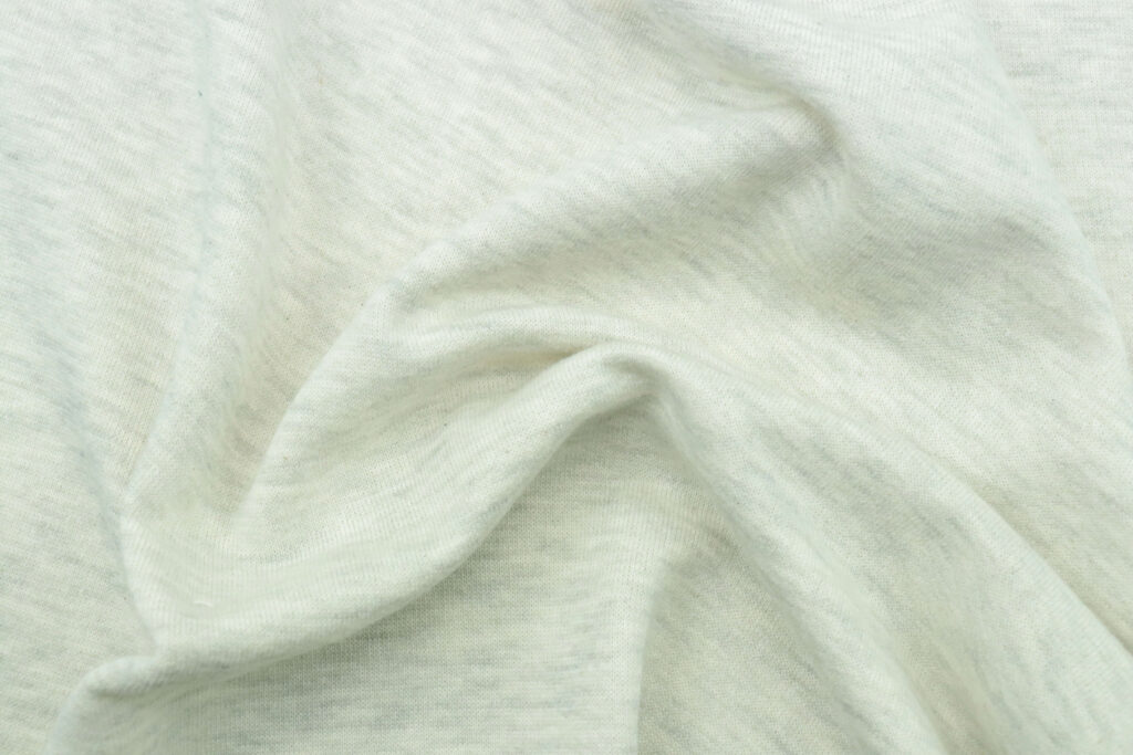 Close-up of organic cotton knit texture — natural fibers for babies